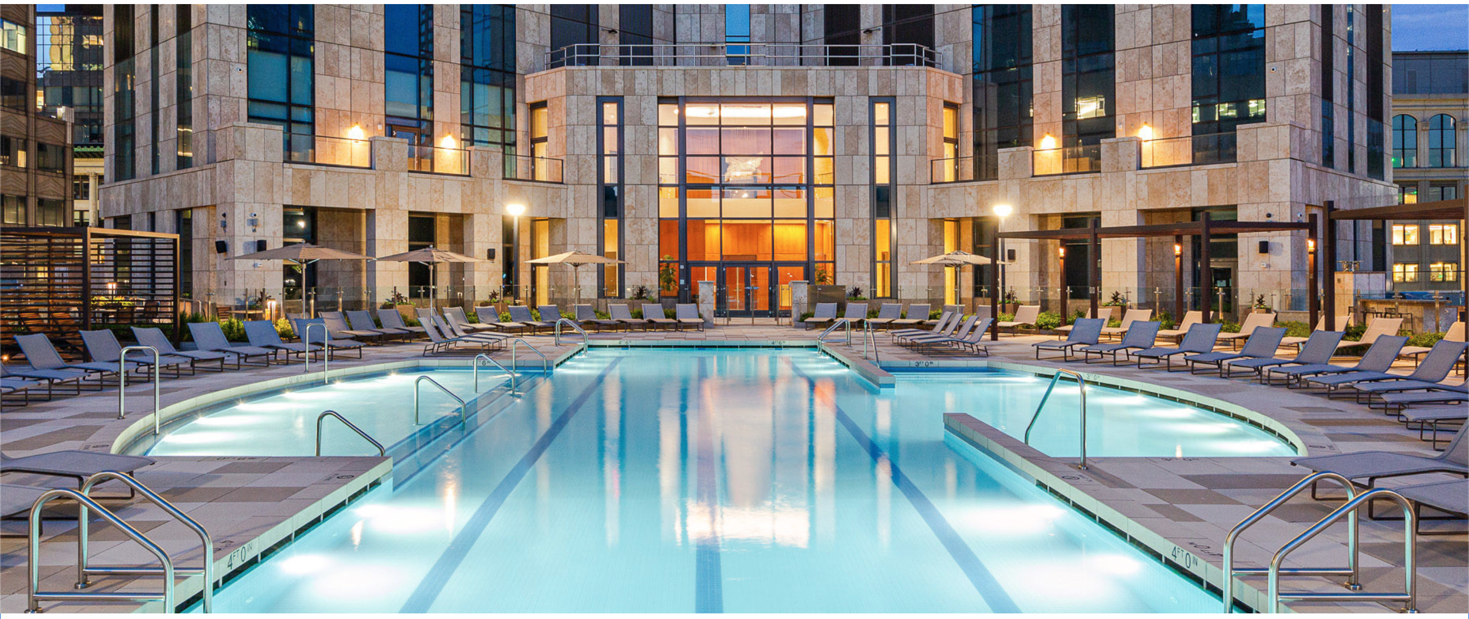99 Hudson outdoor pool and residential facade at dusk
